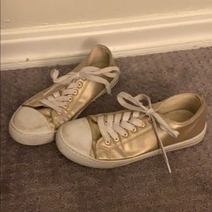 Gold tennis shoes